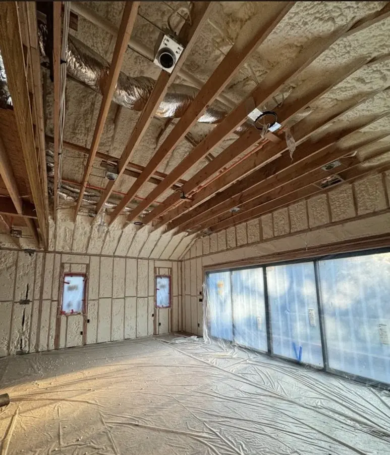 Interior walls and ceiling insulated with spray foam during new construction in Canton